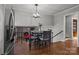 Dining area overlooking the lower level living space with pool table and fireplace at 6621 Fair Lawn Rd, Charlotte, NC 28215