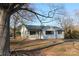 Charming, updated ranch-style home with an inviting front porch and fresh landscaping at 8405 Fairview Rd, Mint Hill, NC 28227