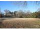 Beautiful view of land with mature trees offering natural serenity and privacy at 8405 Fairview Rd, Mint Hill, NC 28227