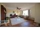 Spacious living room features hardwood floors, neutral paint, and natural light at 8405 Fairview Rd, Mint Hill, NC 28227