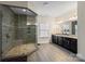 Bathroom with a frameless shower, double vanity, granite counters, and tile floor at 865 Kathy Dianne Dr, Fort Mill, SC 29707