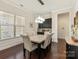 Dining area featuring a window for natural light, a stylish light fixture, and a built-in bar area at 865 Kathy Dianne Dr, Fort Mill, SC 29707