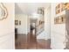 Elegant foyer with hardwood floors, showcasing a staircase and wainscoting, creating a bright and airy entrance at 865 Kathy Dianne Dr, Fort Mill, SC 29707