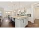 Bright and airy kitchen boasts a large island, pendant lights, and seamless connection to the dining area at 865 Kathy Dianne Dr, Fort Mill, SC 29707
