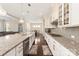 Bright kitchen featuring granite countertops, stainless steel appliances, and hardwood flooring at 865 Kathy Dianne Dr, Fort Mill, SC 29707