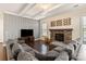 Spacious living room with a stone fireplace, perfect for relaxing and unwinding at 865 Kathy Dianne Dr, Fort Mill, SC 29707