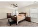 Bright main bedroom with carpet flooring, a ceiling fan, and a matching furniture set at 865 Kathy Dianne Dr, Fort Mill, SC 29707