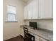 Functional office area with granite counters, storage cabinets, and hardwood floors at 865 Kathy Dianne Dr, Fort Mill, SC 29707