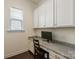 A clean and modern office nook featuring granite counters and white cabinetry at 865 Kathy Dianne Dr, Fort Mill, SC 29707