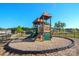 Community playground featuring a fun playset and soft mulch ground cover in a fenced area at 865 Kathy Dianne Dr, Fort Mill, SC 29707