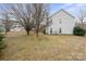Large grassy backyard with mature trees offering ample space at 9413 Pastern Ct, Charlotte, NC 28216