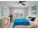 A nicely decorated bedroom features a bed, dresser, rug, and lots of natural light from the double windows at 9413 Pastern Ct, Charlotte, NC 28216