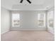 Large unfurnished bedroom offers neutral carpeting, ample natural light from windows, and a spacious layout at 9413 Pastern Ct, Charlotte, NC 28216
