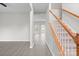 Bright entryway with open floor plan and staircase with wooden banister at 9413 Pastern Ct, Charlotte, NC 28216