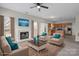 Cozy living room features a fireplace, furnishings, and an open plan to the kitchen at 9413 Pastern Ct, Charlotte, NC 28216