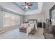 Bedroom with a trey ceiling, a window for natural light, a sofa and matching furniture set at 9711 Tenencia Ct, Charlotte, NC 28277