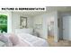 Serene bedroom featuring a comfortable bed, dresser, walk-in closet, and ample natural light. Great for relaxation at 104 Woodhall Way, Troutman, NC 28166