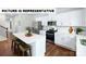 Contemporary kitchen featuring a center island with seating and stainless steel appliances at 104 Woodhall Way, Troutman, NC 28166