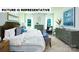 Well-lit main bedroom featuring a comfortable bed and stylish furnishings at 104 Woodhall Way, Troutman, NC 28166