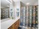 Cozy bathroom features a stylish vanity and shower with patterned curtain at 11420 Glaetzer Ln, Charlotte, NC 28270