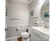 Well-lit half bathroom featuring a modern vanity, toilet, mirror, and decor at 11420 Glaetzer Ln, Charlotte, NC 28270