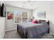Cozy bedroom features natural light, ceiling fan, and carpet flooring at 11420 Glaetzer Ln, Charlotte, NC 28270