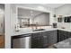 Kitchen featuring stainless steel appliances, an undermount sink, and bar seating at 11420 Glaetzer Ln, Charlotte, NC 28270