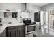 Modern kitchen featuring stainless steel appliances, white subway tile backsplash, and stone countertops at 11420 Glaetzer Ln, Charlotte, NC 28270