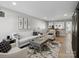 Cozy living room with a white sofa, patterned chairs, and artwork adding a touch of elegance at 11420 Glaetzer Ln, Charlotte, NC 28270
