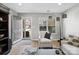 Bright living room with hardwood floors, a stylish armchair, and a large window with natural light at 11420 Glaetzer Ln, Charlotte, NC 28270