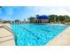 Community pool with clear, blue water and plenty of seating available for residents at 120 Woodhall Way, Troutman, NC 28166