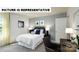Serene bedroom features a comfortable bed, soft lighting, and a dedicated workspace area at 122 Woodhall Way, Troutman, NC 28166