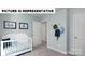 Inviting Bedroom featuring playful ocean themed decor, a crib, and neutral walls at 122 Woodhall Way, Troutman, NC 28166