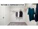 Bright walk-in closet with carpet floors and wire shelving storage at 122 Woodhall Way, Troutman, NC 28166