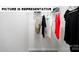 A simple yet functional closet with wire shelving and hanging clothes for storage at 122 Woodhall Way, Troutman, NC 28166