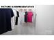 Organized closet with hanging clothes and shelving, maximizing storage space at 122 Woodhall Way, Troutman, NC 28166