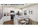 Well-appointed kitchen with granite countertops, stainless steel appliances, and a breakfast bar at 122 Woodhall Way, Troutman, NC 28166