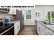 Bright kitchen featuring modern appliances, granite counters, ample storage, and an inviting atmosphere at 122 Woodhall Way, Troutman, NC 28166