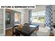 Bright office space with natural light, sleek desk, and views to the outdoors at 122 Woodhall Way, Troutman, NC 28166
