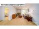 Cozy living room features neutral carpet, couch, wood accents and lots of natural light at 126 Woodhall Way, Troutman, NC 28166