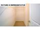 A walk-in closet featuring tan carpet and wire shelving at 126 Woodhall Way, Troutman, NC 28166
