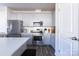 Modern kitchen featuring stainless steel appliances, white subway tile backsplash, and gray cabinets at 12972 Canton Side Ave, Charlotte, NC 28273