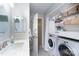 Bathroom with a modern vanity and closet laundry at 1301 Old Pond Ln, Matthews, NC 28105