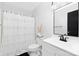 Cozy bathroom featuring white fixtures, shower and decorative mirror at 1304 Browdis Ave, Kannapolis, NC 28083