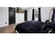 Modern bedroom with wood floors, dark trim, and ample closet space at 1304 Browdis Ave, Kannapolis, NC 28083