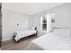 Bright bedroom features two twin beds, wood floors, and sunny window at 1304 Browdis Ave, Kannapolis, NC 28083
