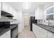Modern kitchen with stainless steel appliances, and stone countertops at 1304 Browdis Ave, Kannapolis, NC 28083