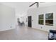 Bright living room with vaulted ceilings, tile flooring, and natural light at 1304 Browdis Ave, Kannapolis, NC 28083