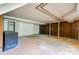 Unfinished basement with concrete floor and wooden walls at 1330 College Ave, Shelby, NC 28152