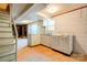 Basement with kitchenette, stairs, and unfinished walls at 1330 College Ave, Shelby, NC 28152